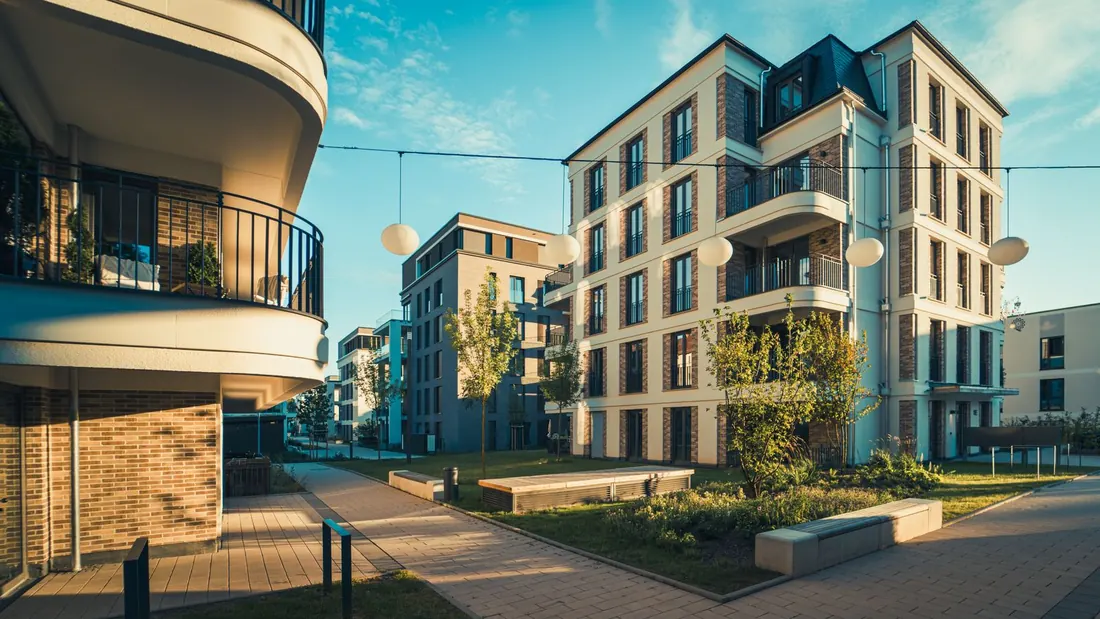 Rental buildings on a sunny street between one guest checking out and the next arriving